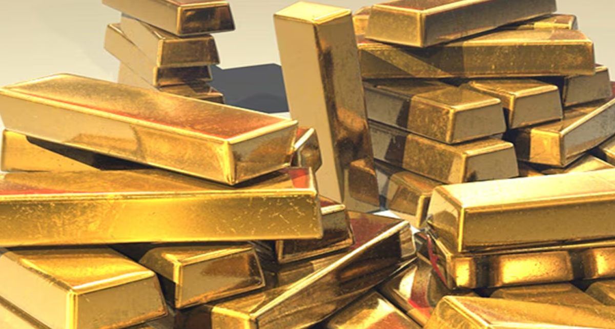 Gold Dips Below Two-Week High Amid Positive Risk Mood
