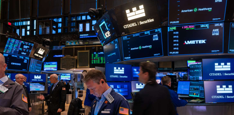 Dow Hits Record High While Nasdaq Slips Amid Tech Sell-Off