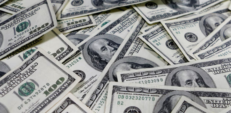 US Dollar Weakens Near 98 as Markets Price Steeper Cuts